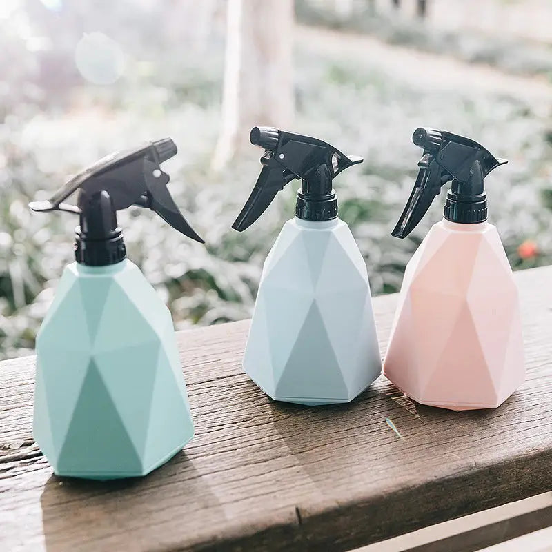 three spray bottles on a bench