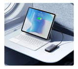 Tablet computer with an attached keyboard and connected external hard drive.