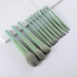 a set of makeup brushes in a white background