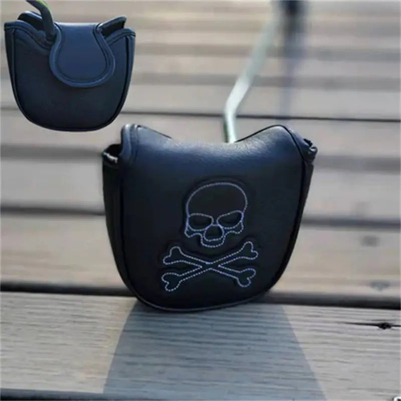 a black purse with a skull and crossbone on it
