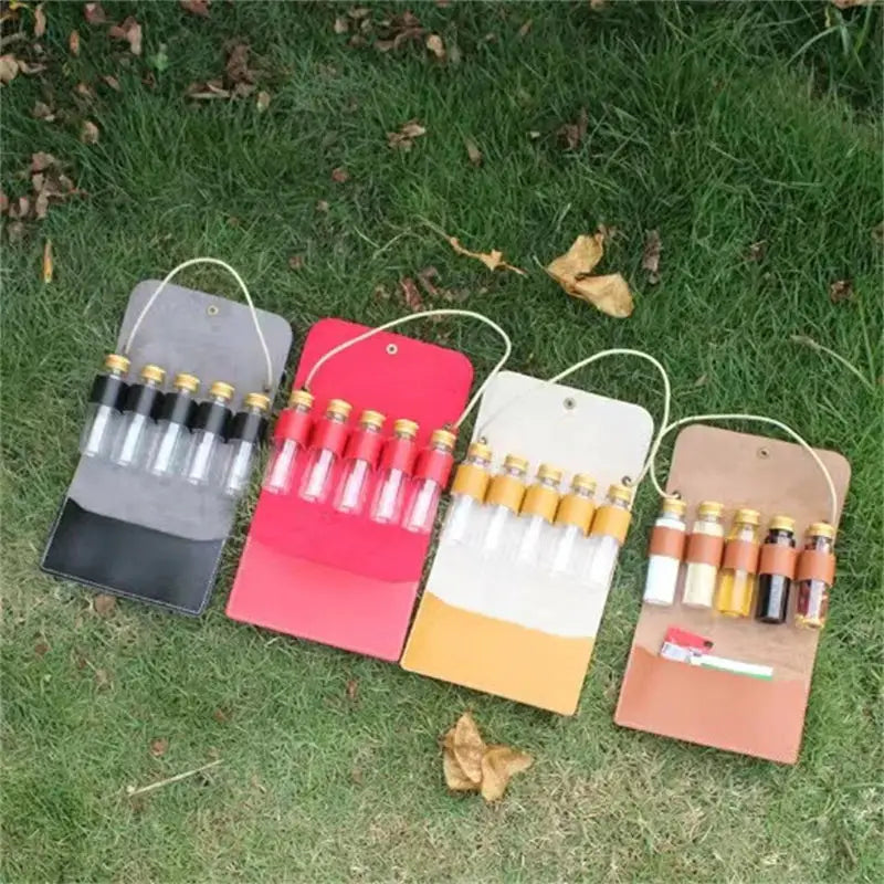 a group of four different colored paper bags