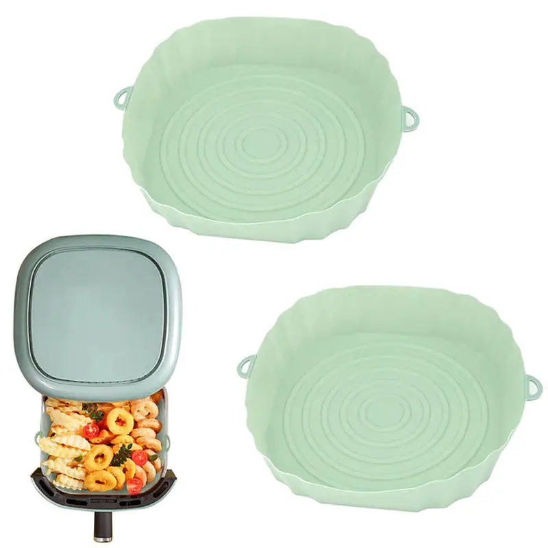 two green ceramic serving dishes with lids