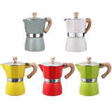 four different colors of coffee pots with wooden handles