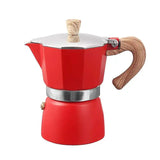 a red stove with a rope on top