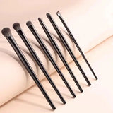 the 5 piece brush set is shown on a white surface