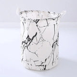 a white and black marble bucket with handles