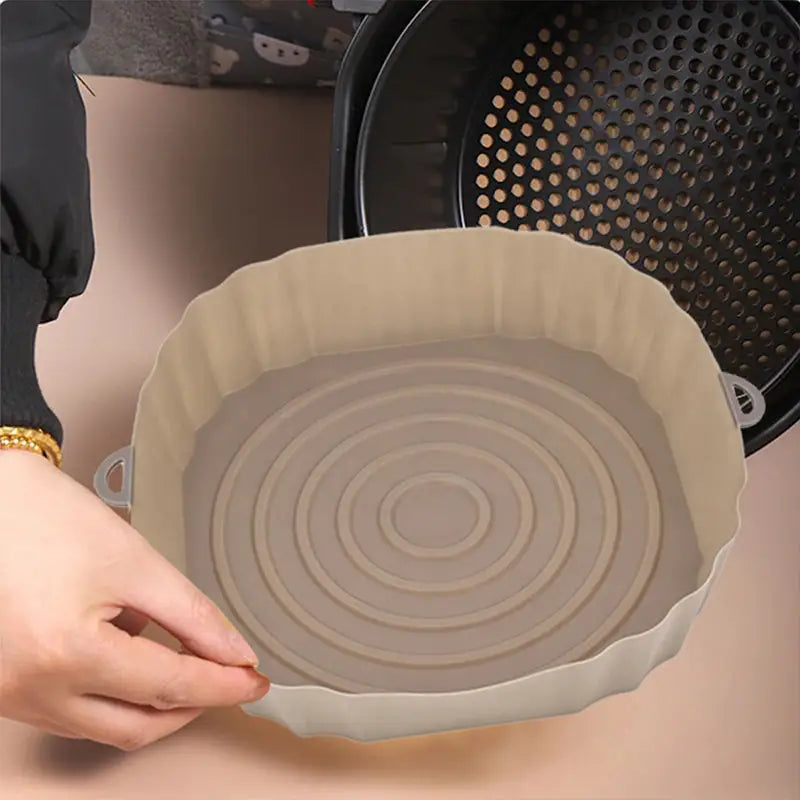 a person is holding a bowl with a large bowl inside