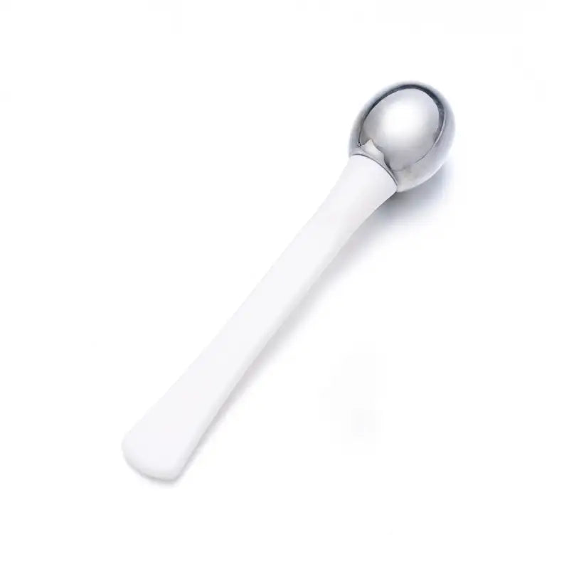 a spoon with a white handle on a white background