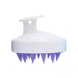 a white and purple brush with spikes on it