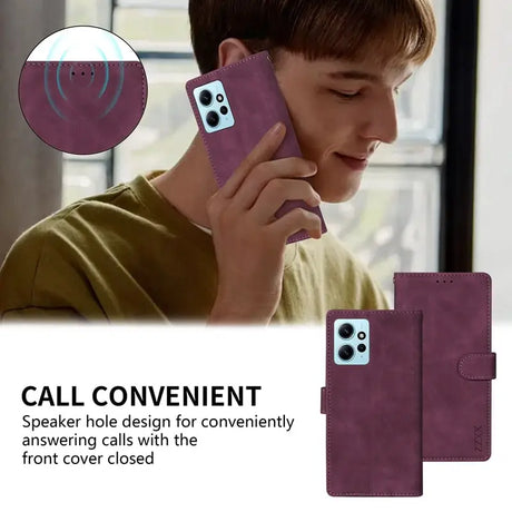 the back of a purple leather case with a boy talking on a cell