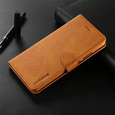 Tan leather wallet or phone case with a flip cover and stitched edges.