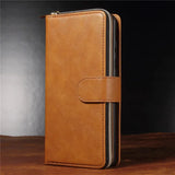 Tan leather wallet with a zipper and snap closure.