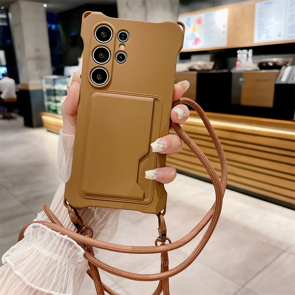 Tan smartphone case with multiple camera cutouts, a card slot, and an attached lanyard.