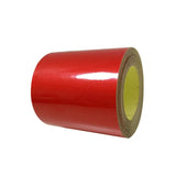 a roll of red tape on a white background