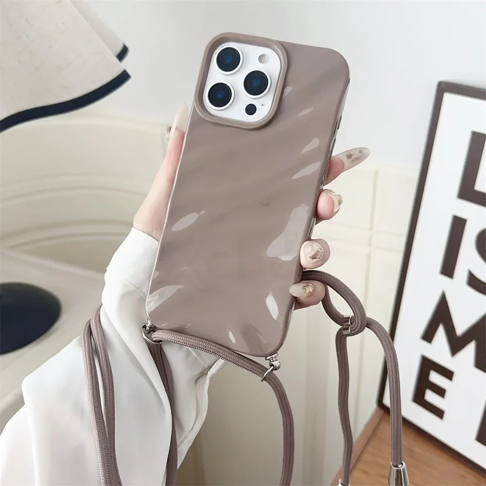 Taupe phone case with crossbody strap.