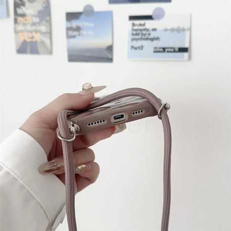 Taupe phone case with lanyard.