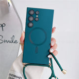 Teal phone case with a camera cutout, circular magnetic ring, and a green lanyard.