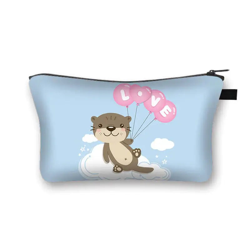 a small bag with a cute otter holding balloons