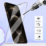 a smartphone with a glass screen and a drill