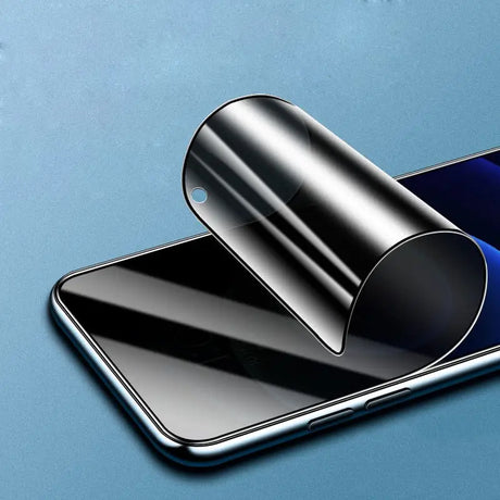 a smartphone with a roll of glass on top