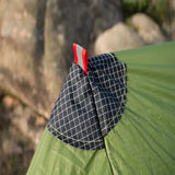 a tent with a sleeping bag attached to it
