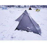 a tent is pitched in the snow