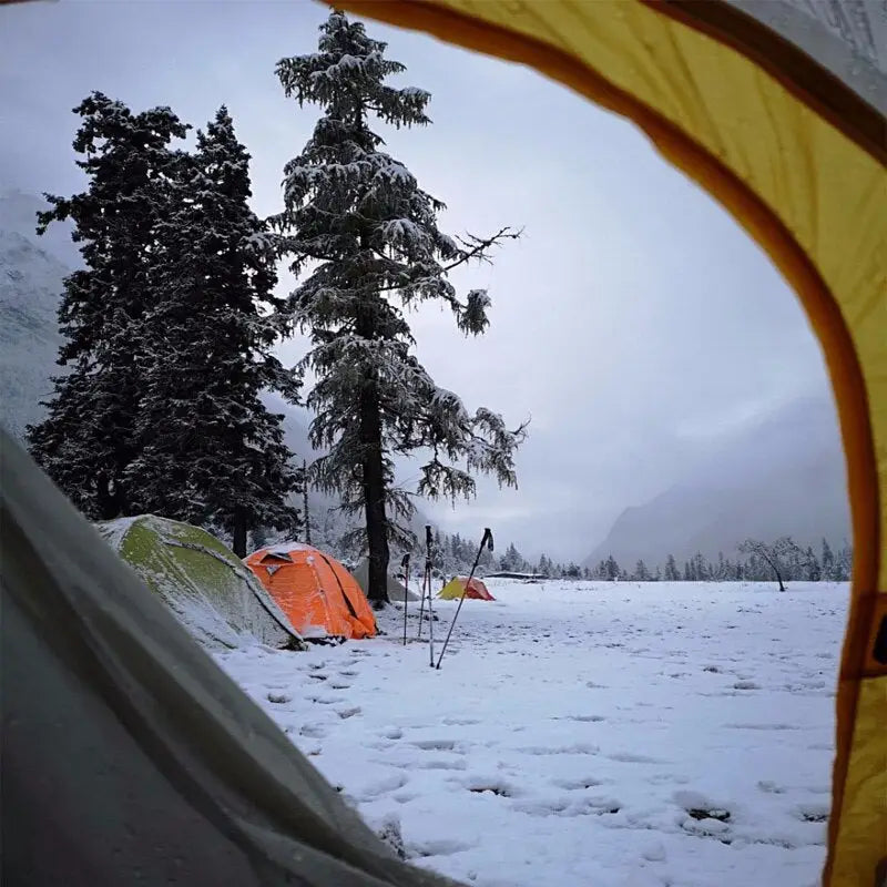 a tent is set up in the snow