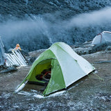 a tent pitched up on a mountain