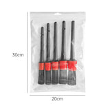 three black and red plastic brushes in a bag