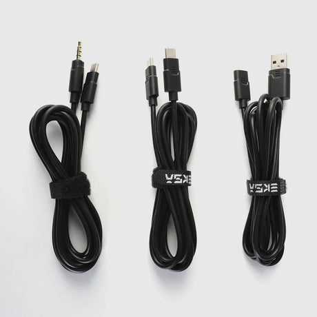 Three black electronic cables bundled with cable ties.