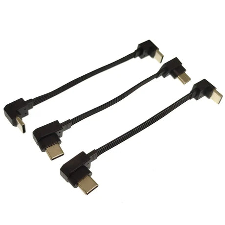 three black and gold colored usb cables connected to each other