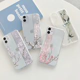 three cases with flowers on them