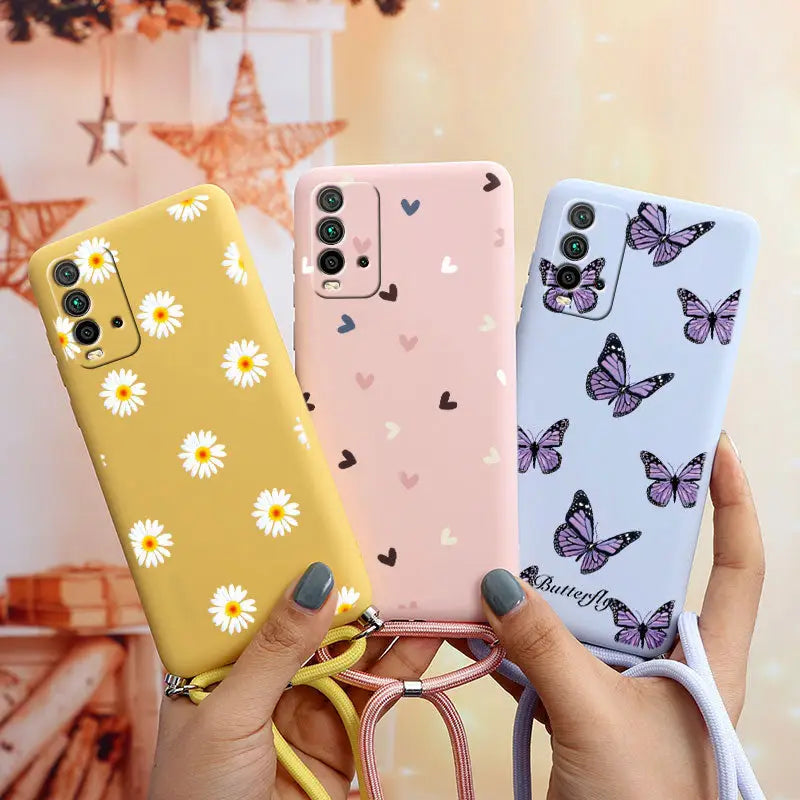 a woman holding two cases with butterflies on them