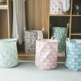 three different color storage bags with handles