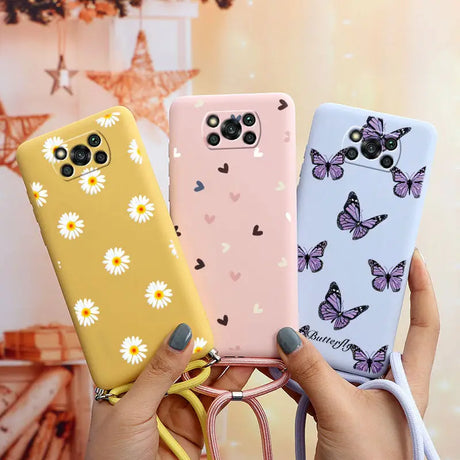 a woman holding two cases with butterflies on them