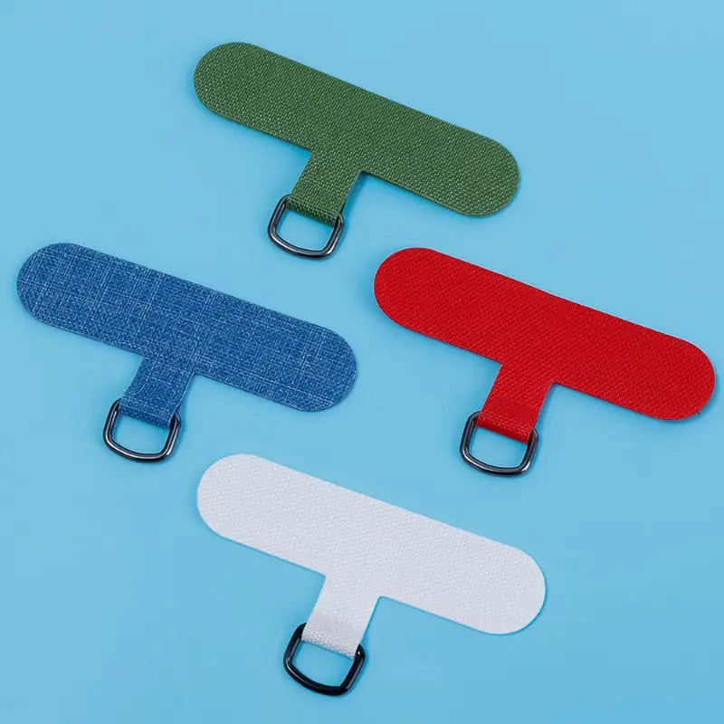 three different colored paper clips on a blue background