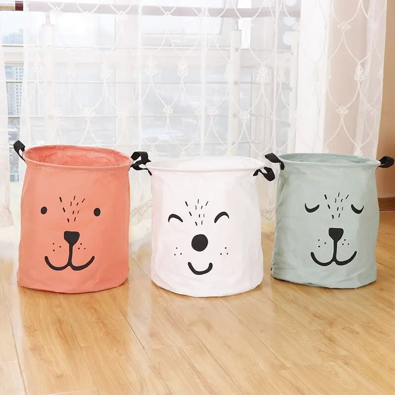 three colorful dog face storage baskets