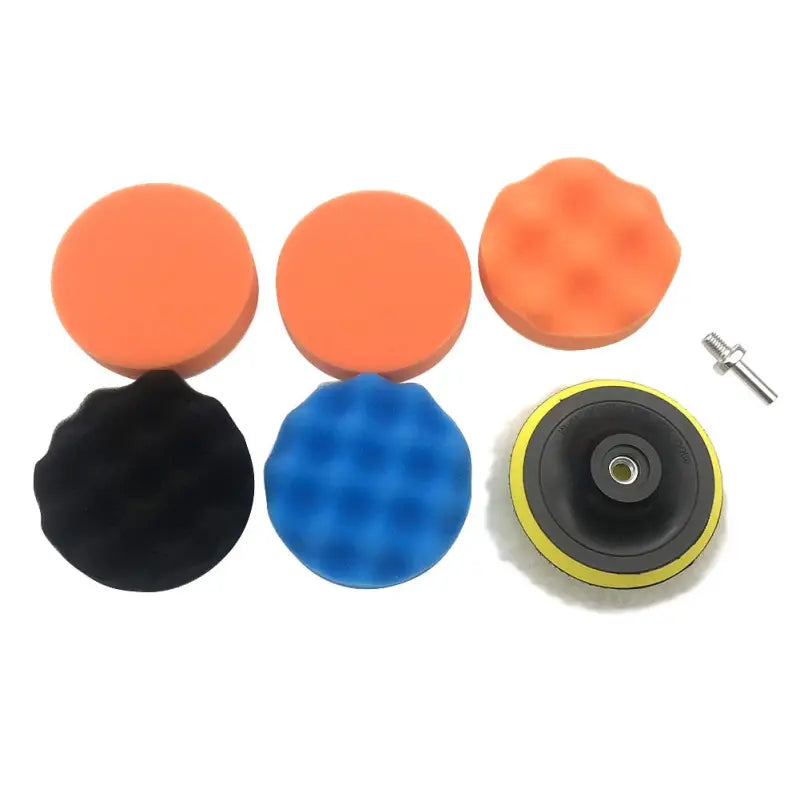 a set of three foam balls with a small plastic disc