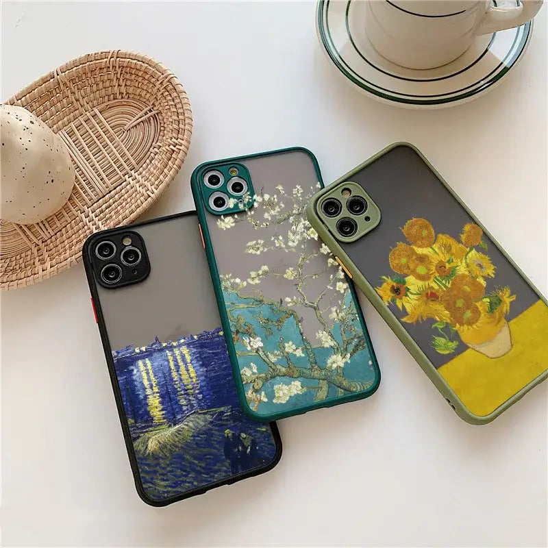 three iphone cases with flowers on them