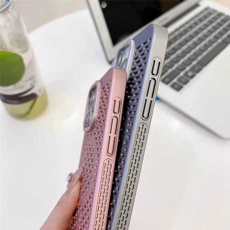 Three iPhone cases in different pastel colors with a textured pattern.