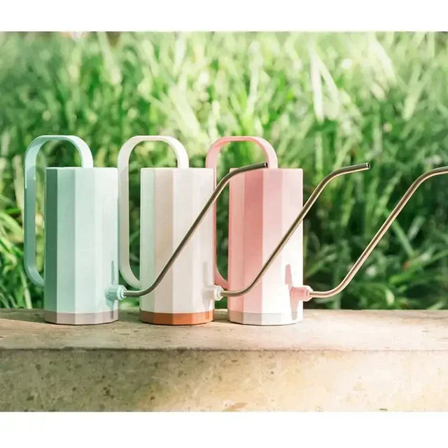 three mugs with handles and handles on a table