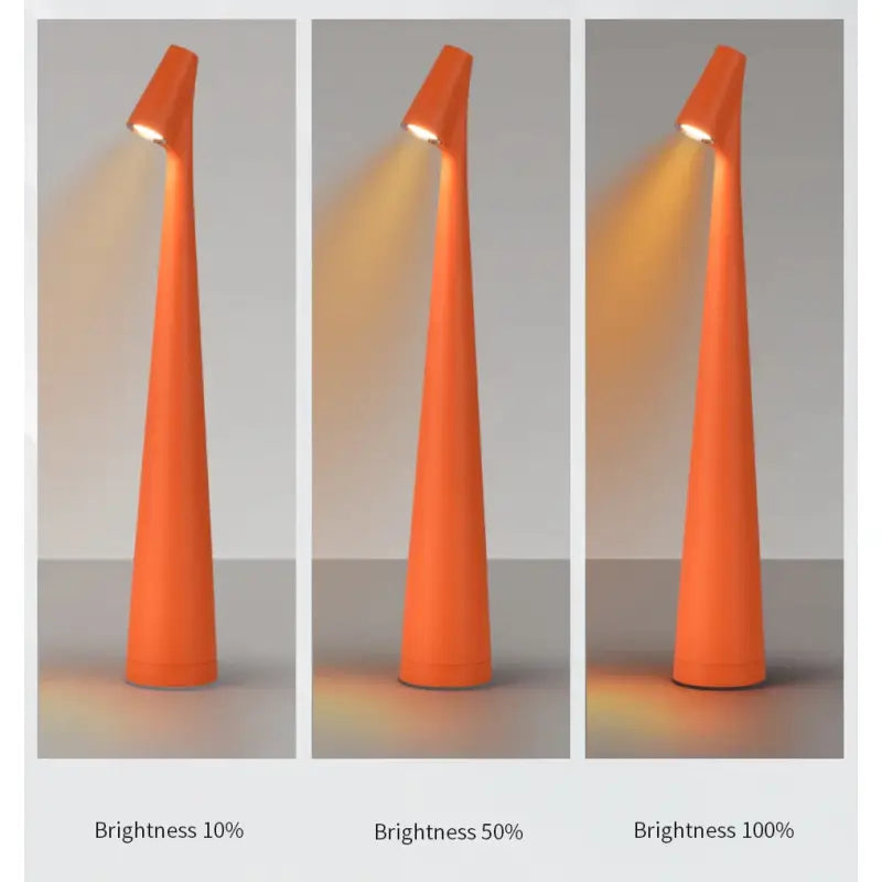 Three orange cones with a light shining on them