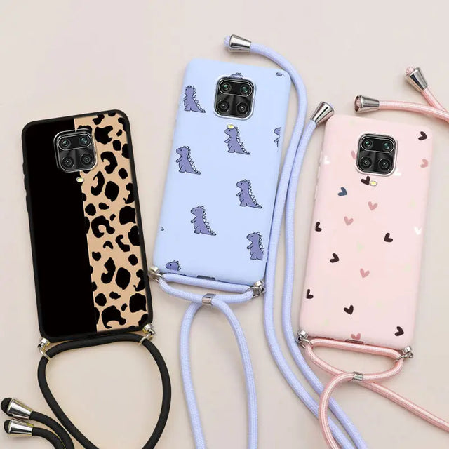 three phone cases with a leash attached to them