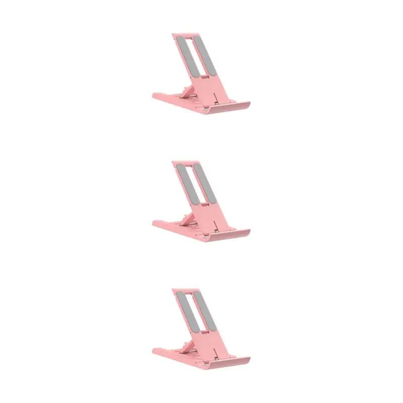 three pink metal stand for a laptop