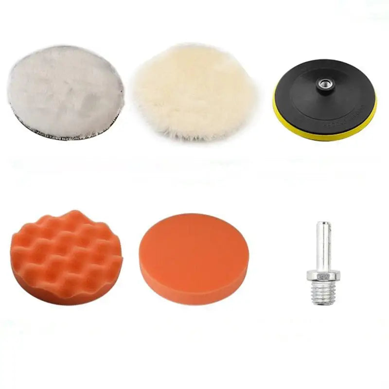 a set of three different polish pads and a brush