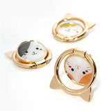 three gold rings with a cat face on them