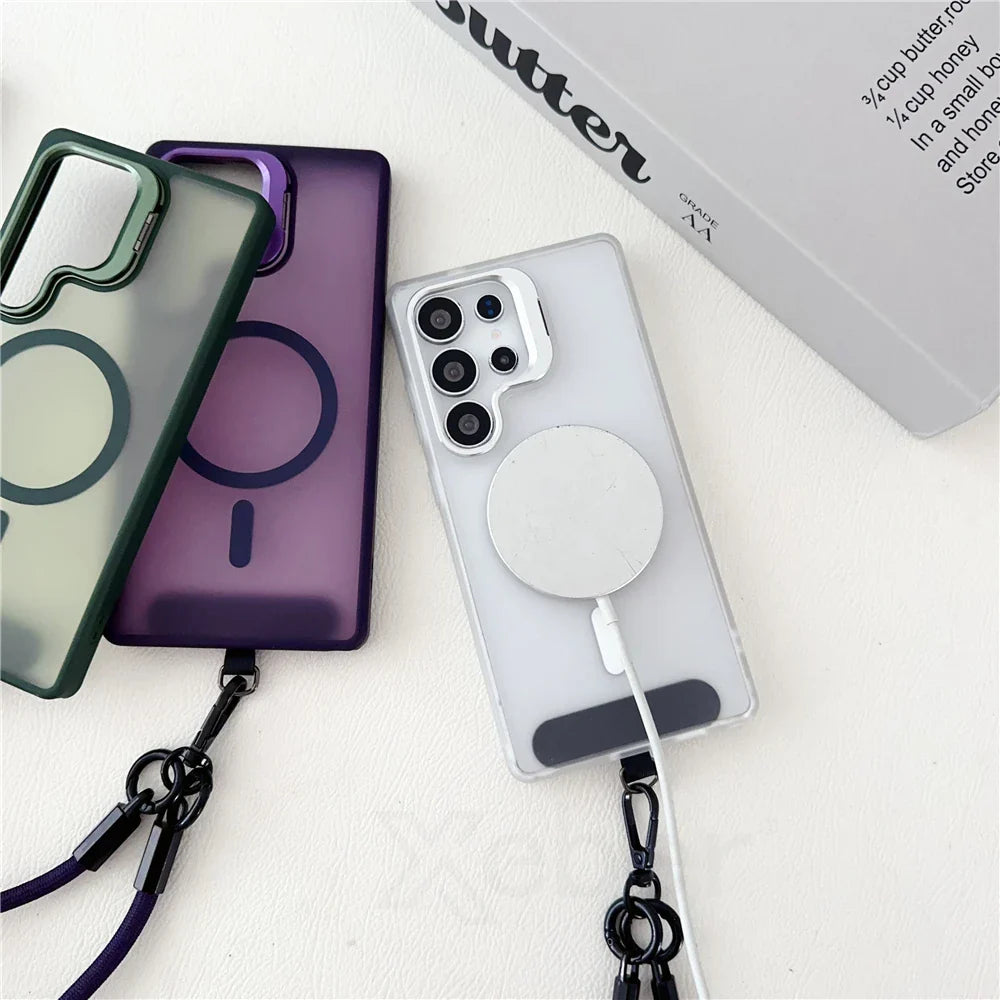 Three transparent phone cases with MagSafe-compatible rings and attached lanyards, with one case on a phone.