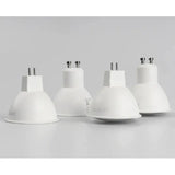 the three white lamps are shown on a white surface