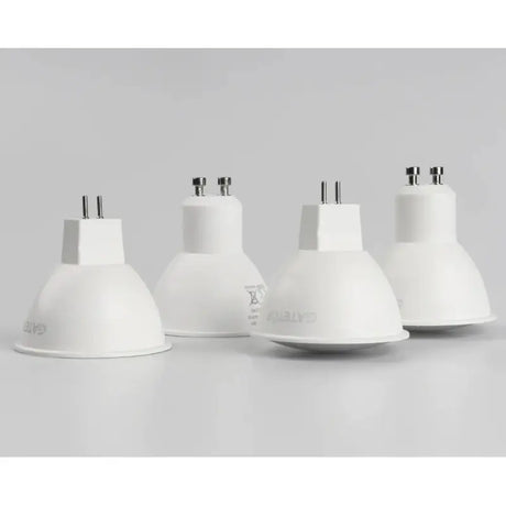 the three white lamps are shown on a white surface