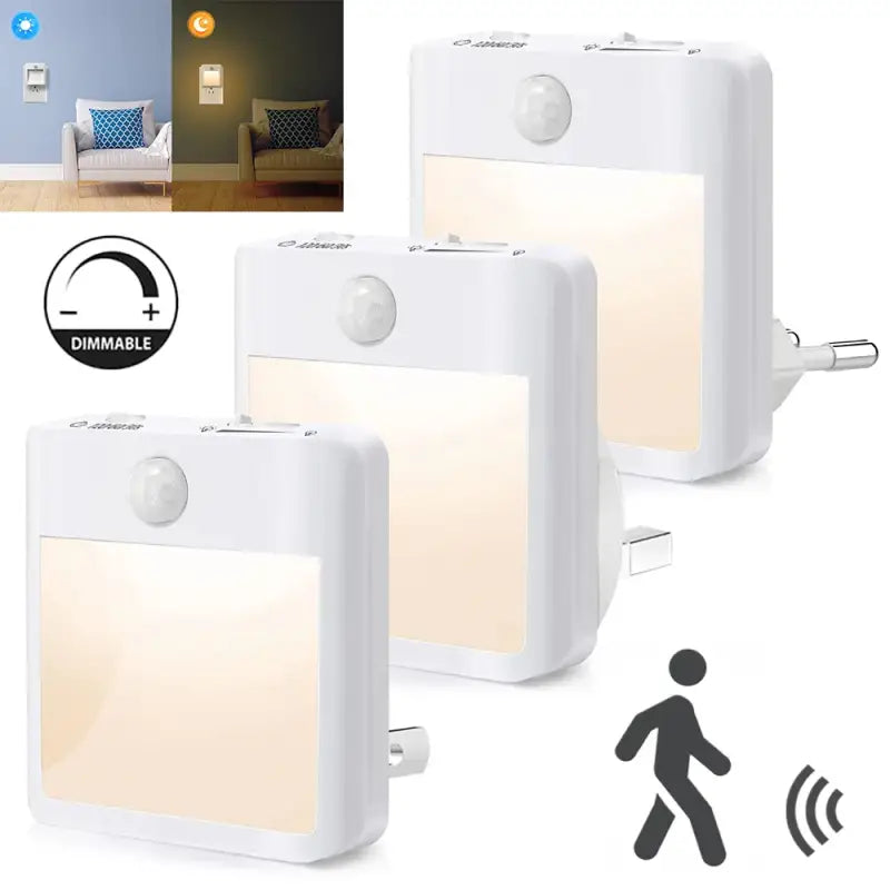 Three white motion sensor night lights with a person walking in the background